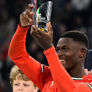 Portugal's defender #25 Nuno Mendes receives the best player award after the UEFA Nations League final football match between Portugal and Spain in Munich, southern Germany on June 8, 2025. (Photo by John MACDOUGALL / AFP) (Photo by JOHN MACDOUGALL/AFP via Getty Images)