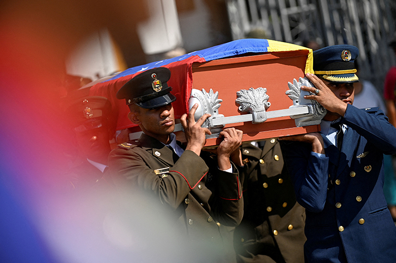 Military personnel carry a casket during the funeral of soldiers killed in the U.S. operation to capture Venezuela’s leader Nicolas Maduro and his wife Cilia Flores in the capital on January 3, at a cemetery in Caracas, Venezuela, January 7, 2026. REUTERS/Maxwell Briceno TPX IMAGES OF THE DAY